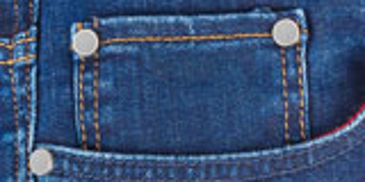Close-up of a jeans pocket with rivets