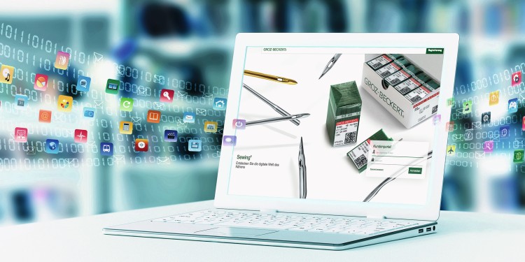 Geöffneter Laptop, auf dessen Bildschirm das Groz-Beckert Kundenportal zu sehen ist