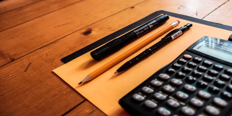 workplace with pencils and calculator